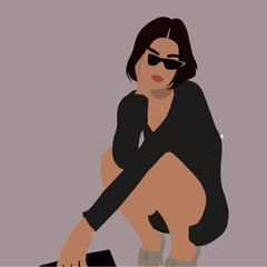 Girl sitting in a black dress with a bag