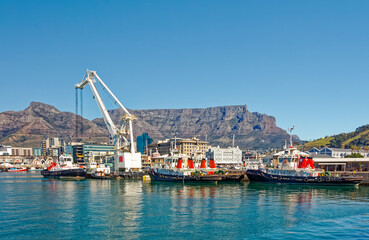 Tug boats and floating crane in Cape Town harbour