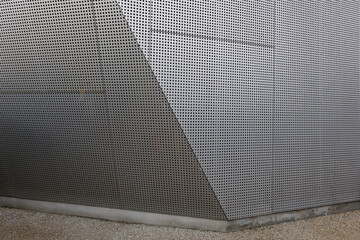 Exterior view at detail of the edge and corner of facade with aluminium composite material. 