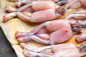 frog legs raw meat on the bone healthy meal food snack on the table copy space food background rustic top view