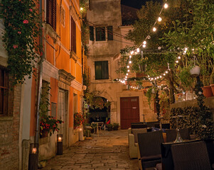 Old street in Porec town illuminated by lamps at the evening, Croatia, Europe - 564720231