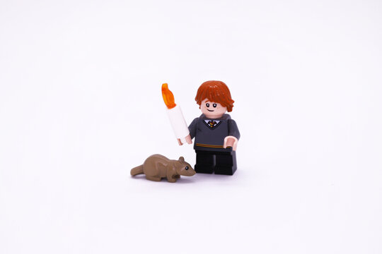 Ron Weasley with his rat Scabbers. Lego toy. Characters from the Harry Potter books and movies. J. K. Rowling. Gryffindor house student. Wizards and sorceress. Collectible figure. Doll.