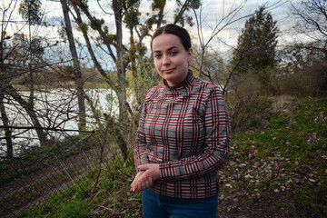 Portrait photo of a girl on the background of nature.