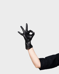 Hand beautician in black glove