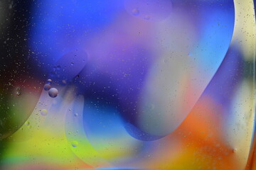 Photo of oil on a water surface with bubbles. Abstract colorful background. Macro close-up, not illustration