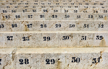 Los números de los asientos en las gradas del público. Plaza de Toros de Málaga, capital de la...