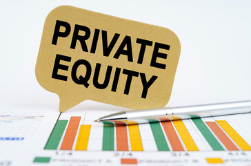 On the financial charts lies a pen and a sign with the inscription - Private equity