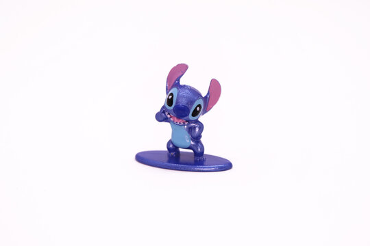 Stitch. Lilo y Stitch. Character from the movie Lilo and Stitch. Experiment 626. Blue creature. Metallic figure on white background. Isolated. Metalfig Disney miniature.