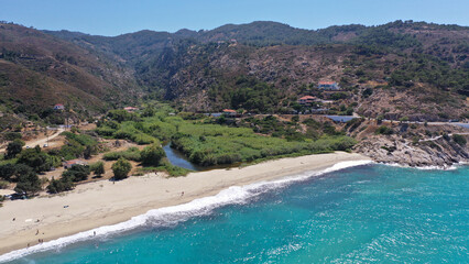 Aerial drone photo of famous wavy beach of Mesakti ideal for wind surfing in island of Ikaria, Aegean, Greece