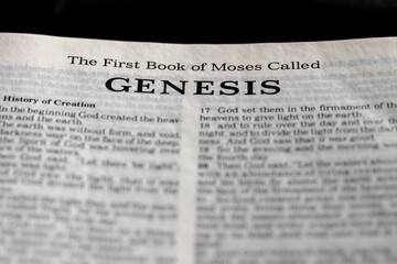 Genesis, the first book of Moses from the bible, title page image with bokeh, Old Testament or...