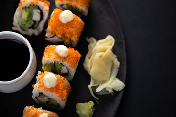 sushi rolls and sticks on table
