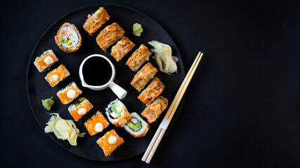 sushi rolls and sticks on table
