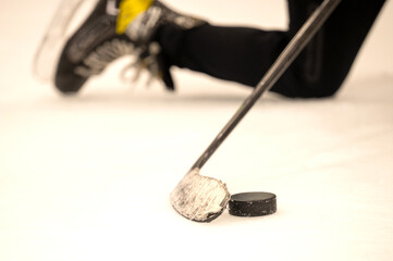 hockey stick with puck on ice