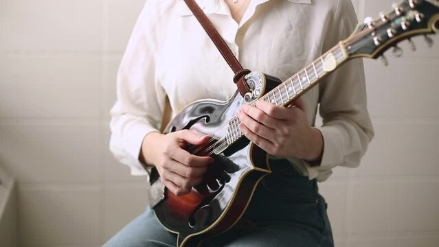 Young Woman Holding Mandolin, Bluegrass Instrument for Acoustic Music