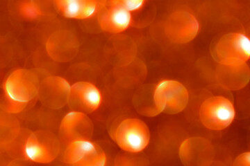 Orange brown bokeh background.  Photo can be used for the concept of New Year, Christmas, Summer season and all celebration backgrounds. 