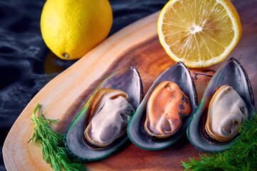 Fototapeta na wymiar mussels open on a wooden platter