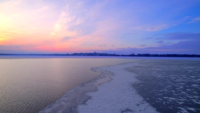 Aerial photo of sunset on a mostly frozen lake Monona, Madison, WI.
