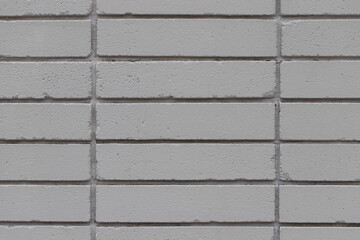 Grey brick wall textured background, closeup