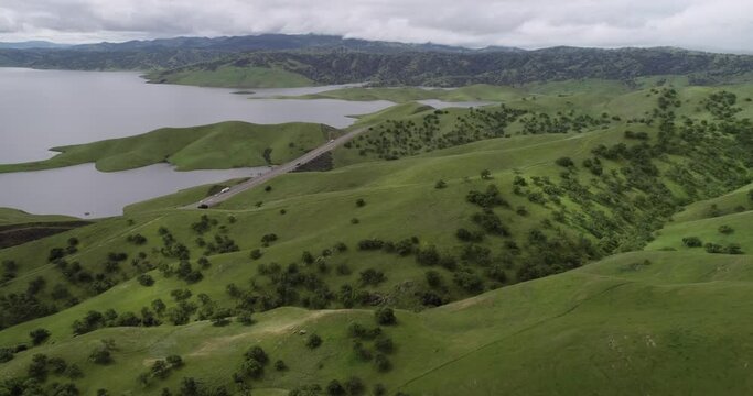Upper Cottonwood Creek Wildlife Area with San Luis Reservoir in Background near Los Banos. California. USA. Mountains and State Road in Background. Lake