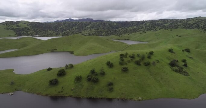 Upper Cottonwood Creek Wildlife Area and San Luis Reservoir. Beautiful Nature and Landscape. Green Area with Cloudy Sk