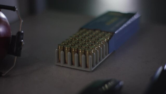 ammunition is fetched from box to reload weapon
