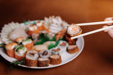 Delicious dish of Japanese food, sushi. With varieties of Japanese food and shoyu. Stylish photo for restaurants