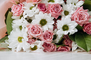 Background of beautiful bouquet of rose and chrysanthemums flowers. Backdrop for holiday, birthday, Wedding, Mother's Day, Valentine's day, Women's Day. Floral arrangement.