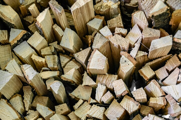 Photography on theme big wall of stacked oak tree logs in cracks