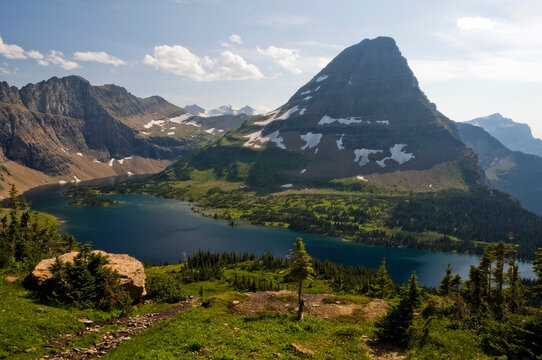 Bearhat Mountain is surrounded by Hidden Lake in Glacier National Park, Montana.