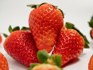 Ripe strawberries on a white background. Strawberries close up.