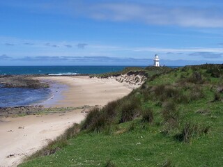 Fototapeta na wymiar lighthouse on the beach
