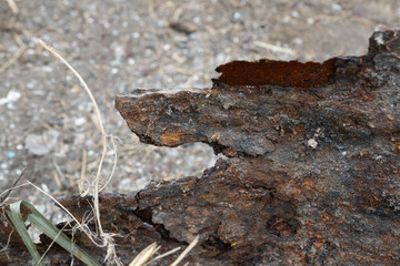 Rusty metal barrel texture, barren atmosphere.