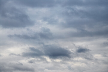 Dark thick clouds cover the sky. The sky in rainy weather