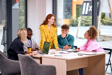 attractive businesswoman with employees working for business project,business team follow direction from businessman leader in office. Executive director female point explain meeting plan in company.