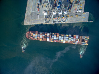 Drone photo of the container-loaded ship approaching the port