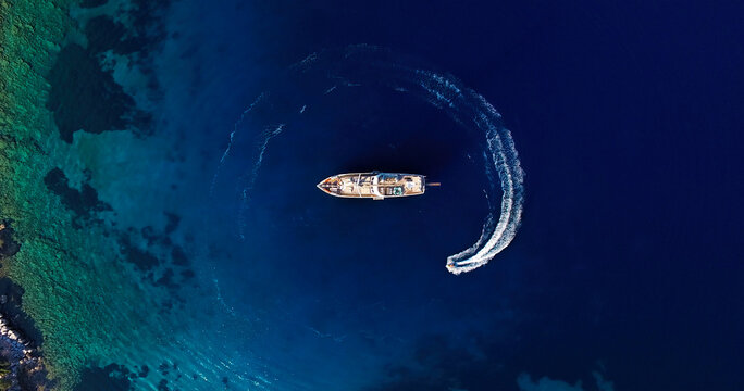 bird's eye drone photo of luxury yacht in the sea