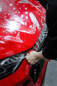 person laying ppf (paint protection film)