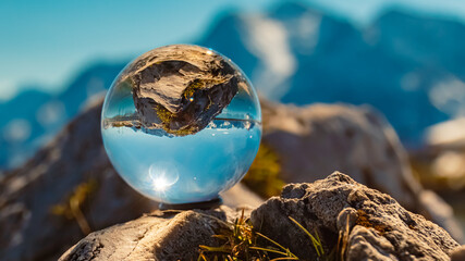 Crystal ball alpine summer landscape shot at the famous Penken summit, Mayrhofen, Tyrol, Austria