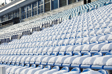 Obraz premium snow the seats of the stadium stands are covered with