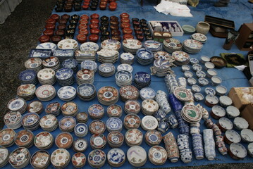 Japanese porcelain dishes on sale at the famout Kobo Market in Kyoto. Imari ware produced in the town of Arita at the Kyushu Island, colorful, decorative ceramic plates.