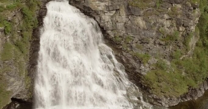 Aerial view of  Rovijokkfossen waterfall on the E8 Nordlysveien road in summer, Storfjord, Troms og Finnmark, Norway.