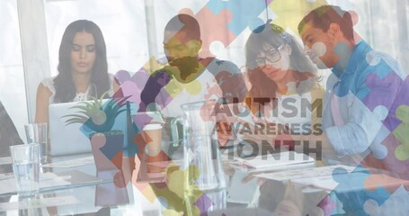 Animation of puzzle and autism awareness month text over diverse students working - Powered by Adobe