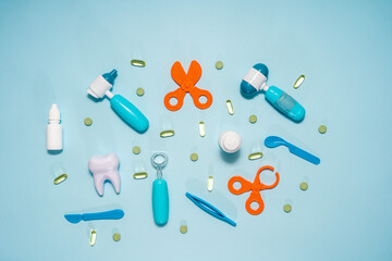 Various medical supplies on blue background. Flat lay