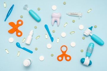 Various healthcare and medical accessories on blue background. Flat lay