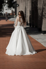 stylish caucasian bride in white wedding dress	