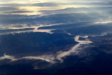 Sunrise over the Smokey Mountains with fog lining the river.