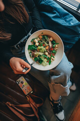 person eating salad