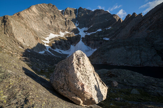 A climber's shadow on a glacial erratic in Spectacle Lakes basin, Rocky Mountain National Park, Colorado.
