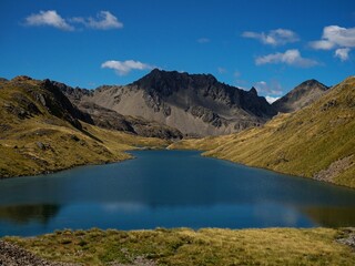 Southern Alps mountain panorama of scenic alpine Hinapouri tarn lake in Nelson Lakes National Park...
