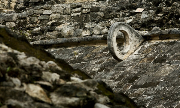 The hoop of a Mayan ball court sits on the side of a wall in the ruins of the ancient Mayan city of Coba in Mexico's Yucatan Pen